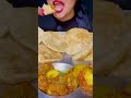 Aloo dum puri eating