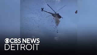 Money dropped from helicopter in Detroit man's honor
