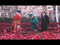 Queen and husband tour field of poppies at Tower of London