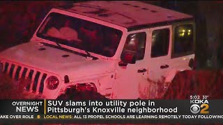 SUV Slams Into Utility Pole