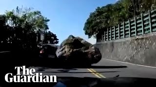 Taiwan earthquake sends boulder crashing into car