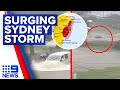 Shocking moment surging floodwaters sweep car out to sea amid Sydney storm | 9 News Australia