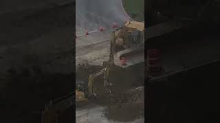 Crews work to repair sinkhole that swallowed car at busy intersection