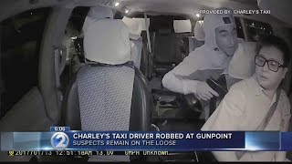 Police investigate taxi robbery caught on surveillance video