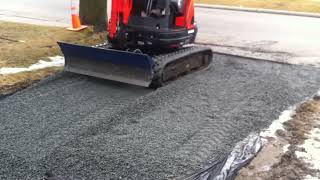 My mini excavator Dozer Blade Extension makes grading driveways and moving loose materials easy