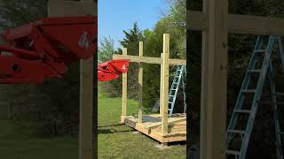 Using the Kubota tractor front end loader to lift board