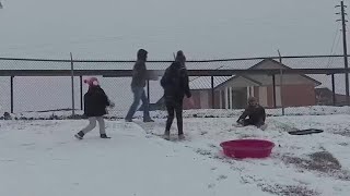 Families enjoy the snow in Geneva