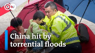 How China's government is tackling 'once in a century' rainfall | DW News