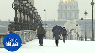 Stunning footage of Paris as first winter snow hits French capital