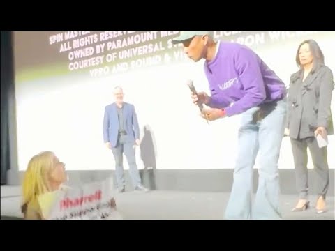 Protester storms stage at premiere of Pharrell's 'Piece by Piece'