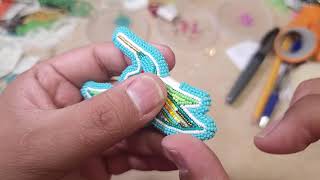 Wrap stitch edging on hummingbird earrings.
