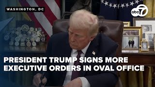 President Donald Trump signs more executive orders in the Oval Office