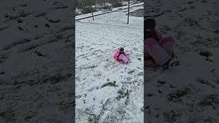 Nicholas and Angela and sledding down the hill ... - Winter 2024