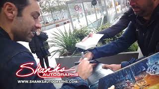 Aidan Turner signing autographs while leaving Virgin Radio London