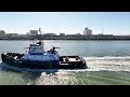 z drive tractor tug denia passing the uss texas in galveston