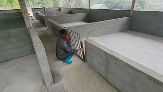 Roofing the pig manure tank, welding iron doors for the pig barn