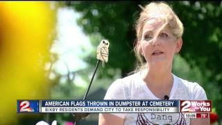 American flags thrown in dumpster
