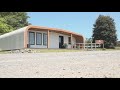 UMaine 3D-printed home made entirely of recycled material toured by HUD official