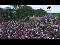 Migrants force through fence as they try to cross border into Mexico