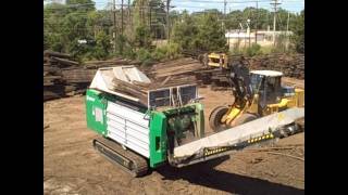 Komptech Crambo Grinding Railroad Ties.wmv