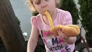 Little Girl Drops Sausage While Taking a Bite of Hot Dog - 1094867