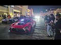 gt racing cars leaving motor city parade before 24h dubai 2025 in the city