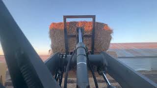 Loading big straw bales