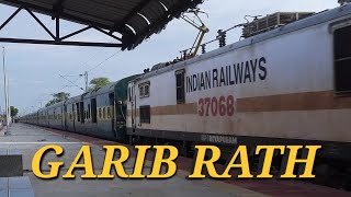 Secunderabad to Visakhapatnam Garib Rath Super Fast Express train cruising through a Railway Station