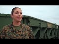 marines building a medium girder bridge