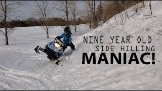 Nine year old teaches us how to side hill a snowmobile