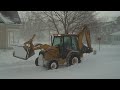 city backhoe plowing