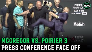Conor McGregor throws kick at Dustin Poirier during UFC 264 First Face Off