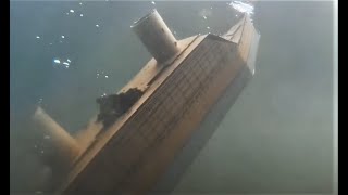 Cardboard ship sinking to the bottom of Lake Cardboardia