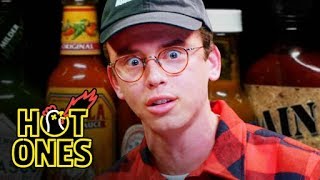 Logic Solves a Rubik's Cube While Eating Spicy Wings | Hot Ones