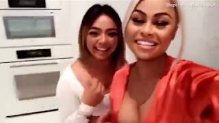 Blac Chyna flaunts cleavage in silk dress at party with pals