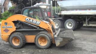 Case SV300 Skid Steer Picking Up Road Grindings