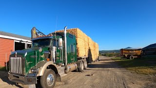 Unloading large straw square bales