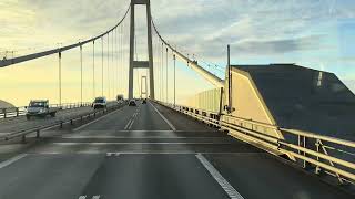 CV. Crossing the Great Belt(Storebælt) Bridge in a Volvo FH truck with a view of a beautiful sunset