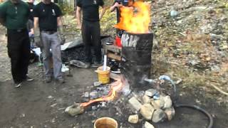 Tapping the slag from an iron smelter