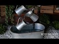 rod works metal watering can fountain