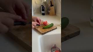 Cutting tomato and cucumber