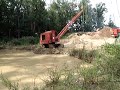 insley cleaning a pond