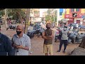 people stand in queue outside chicken shop in karnataka’s hubli amid lockdown