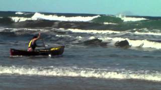 Surfing an open canoe on an ocean beach, NSW coast