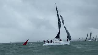 J109 trawls a spinnaker at the leeward mark