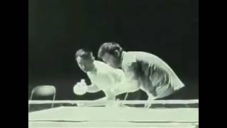 Bruce Lee playing ping pong with nunchucks