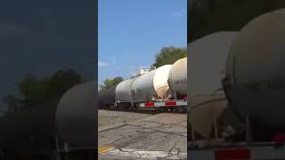 5 engines on CSX freight train with lots of box cars.