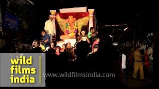 Devotees carrying the idol of Lord Ganesh during Ganesh Chaturthi festival