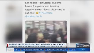 Video surfaces of packed Springdale High School hallway