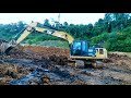 caterpillar excavator digging clay soil top layer coal expose